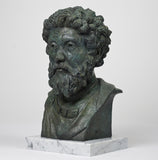 Artist-made detailed sculpture bust of stoic philosopher Marcus Aurelius, in bronze on a marble base, left profile view.